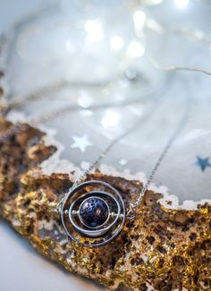 If you like astronomy, galaxies and outer space, this spinning necklace is the perfect accessory for you. This beautiful piece is made with 3 silver-plated brass rings, elegantly placed one inside the other to create a pendant inspired by the planetary galactic orbits. The inner piece is Natural Lava Stone Bead and imitates the texture and shape of an asteroid. ✦ You can spin the necklace! It's truly satisfying and entertaining to spin while you're wearing it! It's almost anti-stress! Such a del Space-themed Pendant Jewelry For Gift, Space-themed Pendant Jewelry Gift, Cosmic Style Handmade Jewelry As A Gift, Handmade Cosmic Jewelry For Gifts, Handmade Cosmic Style Jewelry For Gifts, Sterling Silver Space-themed Jewelry, Silver Space-themed Jewelry Gift, Nickel-free Celestial Stainless Steel Jewelry, Celestial Stainless Steel Nickel-free Jewelry