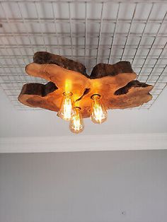 the light fixture is made out of wood