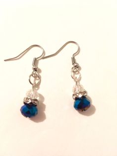 Need a little ... je ne sais quoi? These drop earrings dangle about an inch, and capture the magic of a starlit sky in their iridescent blue hue. Add them to a casual outfit to give it a little pizzaz, or they're the perfect final touch for an evening out. Blue Hypoallergenic Party Earrings, Hypoallergenic Blue Earrings For Party, Blue Nickel-free Crystal Earrings, Blue Crystal Earrings With Ear Wire As Gift, Blue Hypoallergenic Crystal Earrings As Gift, Blue Hypoallergenic Crystal Earrings For Gift, Hypoallergenic Blue Crystal Earrings For Gift, Blue Hypoallergenic Crystal Drop Earrings, Starlit Sky