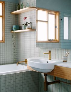 a bathroom with two sinks and a bathtub