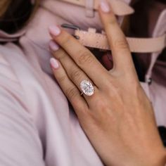 a close up of a person wearing a ring