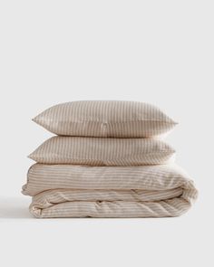 three pillows stacked on top of each other