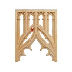 a wooden window frame with an arched design