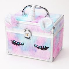 the unicorn makeup box is decorated with faux fur and sequins on it's sides