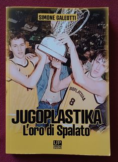 a book with two men holding up a trophy in front of the words jugoplastika l'oro di spaato