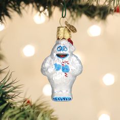 a glass ornament hanging from a christmas tree