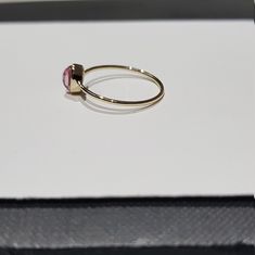 14k solid yellow gold natural oval shaped cabochon tourmaline semi precious gemstone ring. 1. The weight of the natural tourmaline gemstone used in the ring =0.65 cts. 2. The weight of the 14k solid yellow gold used in the ring =0.860 grms. The ring is very nice and beautiful. Thanks Adjustable 14k Gold Oval Opal Ring, Adjustable Oval Opal Ring In 14k Gold, Adjustable 14k Gold Opal Ring, Oval Ruby Ring Stackable For Formal Occasions, Oval Stackable Ruby Ring In Yellow Gold, Tourmaline Ring With Bezel Setting In Oval Cabochon, Tourmaline Bezel Set Ring In Oval Cabochon, Tourmaline Bezel-set Oval Cabochon Ring, Gold Oval Tourmaline Ring