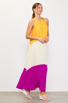 A breezy maxi dress is a must-have in hot weather, and this colorblocked version demands attention. It's bold, fun, and flowy, designed with a shoulder-baring halter neckline, dainty ties, and a cascade of pleats. •Halter neckline with self-ties •Front cutout •Pleated Item Number: 99171 Color Block Maxi Dress, Halter Neckline, Hot Weather, In Hot, Item Number, Color Block, Must Haves, Maxi Dress, Color