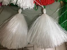 some tassels are hanging on a wall in a room with tile flooring