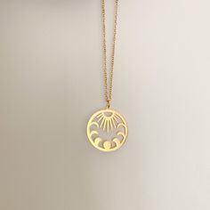 Gold moon phase, sun charm / pendant necklace with a 5cm extended chain (total 45cm), so it is adjustable. This necklace is a hypoallergenic, minimalist and dainty necklace, perfect for layering with another chain! The pendant sits slightly above your breast bone. This is a handmade and packed by myself :)  This has a stainless-steel chain + charm, so it will not fade when it comes into contact with water. In case your jewellery comes into contact with water/liquids, quickly take a cloth and wipe it dry, your necklace should not tarnish or oxidise! I would not recommend showering/ constantly exposing this necklace to water, to make sure the charm, the chain and other components keep their gorgeous shine! The charms may have a few scratches on the surface, however, they are not prominent an Everyday Moon Phase Pendant Necklace, Celestial Stainless Steel Necklace For Gifting, Round Adjustable Necklace With Sun And Moon Design, Celestial Stainless Steel Necklaces As Gift, Minimalist Moon Phase Pendant Necklace, Adjustable Round Sun And Moon Design Necklace, Celestial Stainless Steel Necklace For Gift, Celestial Stainless Steel Necklace As Gift, Celestial Style Stainless Steel Necklace For Gift