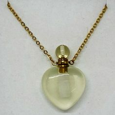 Crystal Perfume Necklace - Citrine Heart Gold Tone Chain This Genuine Gemstone Citrine Heart Shaped Aroma Diffuser Necklace 1" Stone. 21" Stainless Steel Chain, 2' Extender, Lobster Clasp Closure. Comes Gift Boxed With Doppler. Add Essential Oil, Perfume, Moon Water. Goddess Crystals, Perfume Necklace, Ethereal Jewelry, Moon Water, Bead Diy, Crystal Goddess, Oil Perfume, Diffuser Necklace, Jewelry Accessories Ideas