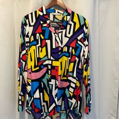 Never Worn, Beautiful Condition. Would Pair Well With A Blazer Vibrant Multicolor Print V-neck Blouse, Multicolor Abstract Print Long Sleeve Shirt, Vintage Multicolor Abstract Print Blouse, Multicolor Vibrant Print Button-up Top, Multicolor Abstract Print Button-up Blouse, Blue Black, Top Blouse, Womens Tops, Blazer