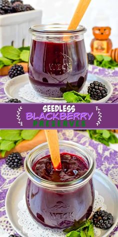 two jars filled with blueberry jam sitting on top of a white plate