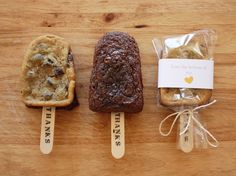 three pieces of bread sitting on top of a wooden table