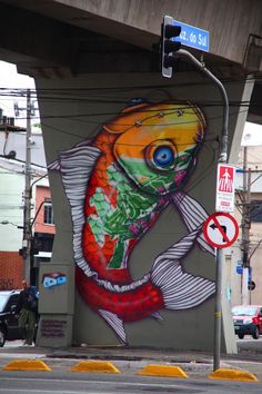 a large fish painted on the side of a building