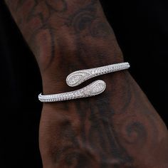 Introducing the Iced Bandana Cuff in White Gold- the perfect way to ice out your wrist. This bracelet features a 14k White Gold band covered in micro pave hand-set stones, teardrop accents on each end, and complete with a spring hinge for easy wear while staying on securely. Pair this with the Iced Bandana Ring for a matching set! This product is guaranteed for life – GLD will repair or replace the item should you experience any defects in craftsmanship or breakage. Specifications - Width: 5mm - Bandana Ring, Latest Bracelets, Vermeil Jewelry, Custom Earrings, White Gold Band, Gold Plated Bracelets, Spring Hinge, Drop Necklace, Pendant Bracelet