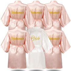 six bridesmaid robes in pink and white with gold embroidered on the front, back, and sides