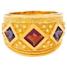 ETRUSCAN REVIVAL STYLE 14K YELLOW GOLD AND GEMSTONE RING SIZE 8 Item # 308GEX11P A positively stunning vintage ring by Art's Elegance, it features a stippled-ground with raised high-polish square bezel-set gemstones set within a twisted-rope border. It is executed in solid 14 karat yellow gold and retains the original maker's mark on the inside of the ring. Note, we may have the matching bracelet from the same estate available in the gallery (item # 308QAJ11Z) Specifications: * Composition: 14k Yellow Gold Gemstone Rings, Rope Border, Bracelet Love, Antique Doors, Ring Pictures, Antique Paint, Matching Bracelet, Maker's Mark, Matching Bracelets