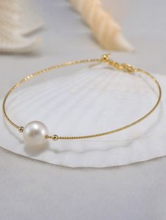 This elegant and timeless pearl bracelet is perfect for everyday wear. It also makes an ideal gift for your loved one, you can't go wrong and it will be treasured for many years to come. FEATURES Metal: 925 Sterling Silver, Silver Color: Gold Stone: ColorWhite Metal Color: Gold Plated, 18K Gold Plated ----------------------------------- PLEASE NOTE : Please keep in mind that these are natural pearls and while I do my best to match my pair, they may not be perfectly identical to man-made pearls. Classic Pearl Charm Chain Bracelet For Wedding, Wedding Gold Bracelet With Pearl Drop, Wedding Gold Pearl Bracelet With Pearl Drop, Wedding Gold Pearl Drop Bracelet, Minimalist Pearl Bracelet For Anniversary With Pearl Chain, Minimalist Pearl Drop Bracelet For Anniversary, Elegant Bangle Bracelets For Bridesmaid Gift, Minimalist Formal Pearl Drop Bracelet, Formal Pearl Chain Bracelet