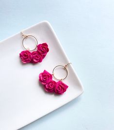 Fuchsia/ Hot Pink Roses Hand sculpted petal by petal 18k Gold Plated metals Extremely light weight These earrings are made of polymer clay, slightly flexible material, individually cut and assembled.   Every piece is light and easy to wear. *No two earrings are perfectly the same, everything is handmade.  We try our best for all pieces to look just like what you see in each picture. PLEASE BE ADVISED-  Some styles might have a slight difference from the picture. It means we have improved the loo Polymore Clay, Pink Rose Earrings, Hot Pink Roses, Clay Polymer, Pottery Clay, Artisan Earrings, Long Periods, Plant Mom, Floral Gifts