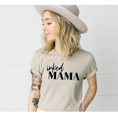 "Hand Pressed Inked Mama Tee DETAILS: Our unisex sized tees are soft and super comfortable. The styling possibilities are endless.. Roll up the sleeves, tie a side knot, front tuck, or wear it while lounging around the house.. We guarantee that you will love the fit, and the softness of this shirt. Design: Inked Mama in Black Screen Print You Choose your shirt Color Please check the sizing before you order. These are unisex sized, so the fit will be looser if you order your normal women's size. Relaxed Fit Shirt With Name Print For Summer, Relaxed Fit Summer Shirt With Name Print, Casual Graphic Print Shirt For Mother's Day, Casual Everyday Tops With Name Print, Mother's Day Casual Crew Neck Tops, Casual Mother's Day Shirt With Text Print, Casual Shirt With Name Print For Mother's Day, Trendy Crew Neck Shirt For Mother's Day, Casual Shirt With Text Print For Mother's Day