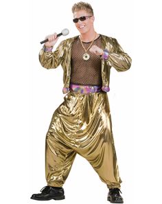 a man dressed in gold is holding a microphone and singing into a mic while wearing sunglasses