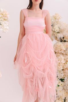 Step into a fairytale in the enchanting Aurora Dress. Crafted from the softest pink tulle, this gown feels like floating on a cloud. The cascading layers of draperies create a gorgeous, flowing silhouette that moves gracefully with every step. Lined with duchess satin, this piece is adorned with dreamy ribbon trims. Delicate off-shoulder sleeves and intricate corset lacing complete the romantic look. Handmade with love for the modern princess, the Aurora Dress is designed to be cherished and tre Aurora Dress, Corset Lace, Duchess Satin, Modern Princess, Pink Tulle, Romantic Look, Ribbon Trim, Satin Ribbon, Xl Dress