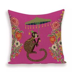 a pink pillow with a monkey holding an umbrella