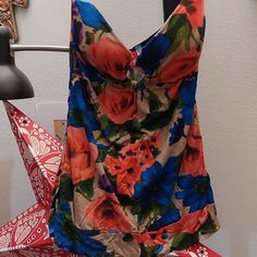 Super Pretty And Cute Strapless Floral Top. Lightly Padded Cups For Support With A Keyhole Opening. Tan Background With Bright Coral And Blue Flowers. Brand New Never Worn Casual Multicolor Tops With Built-in Bra, Sleeveless Tops With Built-in Bra For Poolside, Multicolor Beach Tops With Built-in Bra, Blue Tank Top For Poolside Spring, Blue Tank Top For Poolside Spring Season, Multicolor Vacation Tops With Built-in Bra, Spring Tops With Built-in Bra For Poolside, Summer Multicolor Tops With Built-in Bra, Casual Poolside Tops With Built-in Bra