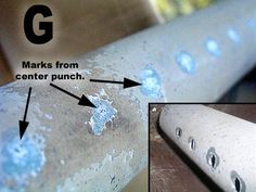 a close up of a metal pipe with holes in it and an arrow pointing to the center punch