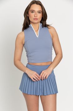 Our Dusty Blue Pleated Tennis Skirt is the best everyday piece to add to your wardrobe because of their versatility & functionality. It features built-in spandex shorts that include a comfortable fit and side pockets for storage. This exclusively designed Gold Hinge skirt is made of quick dry material and can take on any activity such as golf, tennis, running and more. Sporty Blue Skort With Built-in Shorts, Sporty Blue Short Length Skort, Blue Athleisure Tennis Skirt For Spring, Blue Athleisure Tennis Skirt, Sporty Short Blue Tennis Skirt, Blue Athleisure Tennis Skirt For Sports, Blue Fitted Short Tennis Skirt, Blue Stretch Tennis Skirt With Built-in Shorts, Blue Tennis Skirt With Built-in Shorts