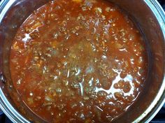 a large pot filled with lots of food sitting on top of a stove burner