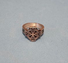 This ring was designed with the solar cross symbol. The beautiful pewter ring is a silver color and the background is blackened to bring out the fine detail of the design. Our rings are 100% Lead and nickel free pewter and made in the USA The top design part of the ring measures approx. 12mm x 12mm  The ring band tapers from about 5mm to about 4mm at the bottom and is about 1.5mm thick Picture shows size compared to a US Dime Rings are available in sizes 4 to 7 (half sizes also) Solar Cross, Pewter Ring, Cross Symbol, Petite Ring, Ladies Ring, Top Design, Ring Band, Rings Statement, Women Rings