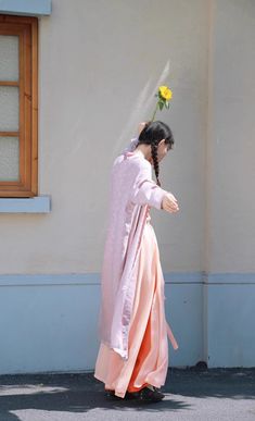 Step into a harmonious blend of history and modern fashion with the colorful Jüzi Qishui 橘子汽水 Orange Soda Changshan & Double Layered Trousers Set! The Changshan 长衫 (long shirt) is made from lightweight and breathable floral jacquard, featuring a contrast trim down the length of the jacket. Elongates the body and adds an extra layer of coverage! Side slits allow the rest of the outfit to peek through and adds ventilation, perfect for even the warmest of days. The Song Ku 宋裤 (Song Dynasty trousers Traditional Ceremonial Sets For Spring, Traditional Spring Kimono, Pink Long Sleeve Sets For Transitional Season, Traditional Spring Wedding Kimono, Traditional Pink Kimono For Spring, Pink Kimono For Spring Wedding, Long Pink Festive Kimono, Spring Wedding Sets With Stand Collar, Ceremonial Pink Long Sleeve Sets