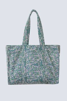 HANDMADE EDITION a panel blockprinted bag in a sturdy canvas, to tote everything from your laptop to your gym clothes. the snaps on the sides can be undone for more space. two interior pockets. dimensions: 19" W x 13" H x 6" D handle drop: 10.5" made of 100% cotton canvas. lined in 100% cotton. made in india. spot clean. Weekend Cotton Bags With Pockets, Weekend Cotton Bag With Pockets, Weekend Cotton Bag With Double Handles, Cotton Weekend Bag With Pockets, Casual Cotton Tote Weekender Bag, Casual Cotton Rectangular Weekender Bag, Weekend Cotton Rectangular Bag, Blue Cotton Canvas Bag With Double Handle, Rectangular Cotton Bags For Weekend