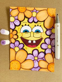 a drawing of a cartoon character with flowers on it and two markers next to it