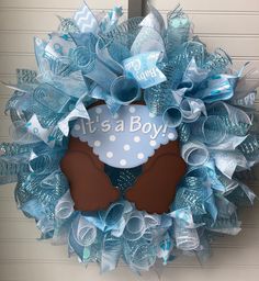 a blue wreath with a teddy bear on it that says, i'm a boy