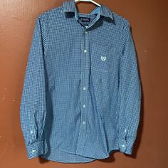 New Chaps Blue/White Plaid Button-Up Longsleeve Shirt. In Great Condition, No Rips Does Have A Tiny Small Stain On Collar(See Photo). I Really Don’t Know How That Got There. But If You Can Get It Out, Awesome Please Take It! Never Been Worn Tags Fell Off, But Has A Small Sticker Under The C Logo(See Photo). All Buttons Are Intact. Great Shirt For Going Out. Casual Blue Button-up Dress Shirt, Casual Long Sleeve Dress Shirt With Buttons, Casual Blue Dress Shirt For Work, Preppy Blue Button-up Tops, Preppy Blue Shirt With Button Closure, Blue Preppy Shirt For Workwear, Blue Preppy Shirt For Work, Preppy Blue Shirt For Work, Casual Long Sleeve Dress Shirt With Button Closure