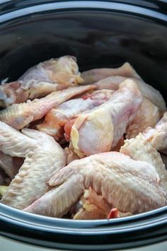 raw chicken in the crock pot ready to be put into the slow cooker