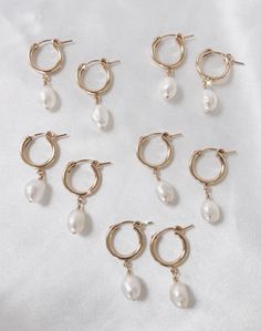 Pretty white & shimmery baroque pearls are hand wired onto 14k gold filled huggie hoops. Hoop is about 14mm and total length is about 1.25 inches. Safe for sensitive skin Tarnish Proof 14k Gold-filled Huggie Hoop Earrings With Pearl Charm, White 14k Gold Filled Hoop Earrings, Dainty White 14k Gold Filled Huggie Earrings, White Hoop Earrings With Baroque Pearl Charm, Small Hoop White Huggie Earrings In 14k Gold, White Pearl Drop Hoop Earrings In 14k Gold, White Baroque Pearl Hoop Earrings With Charm, White 14k Gold Filled Huggie Earrings, Hypoallergenic Pearl Huggie Hoop Earrings