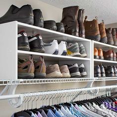 several pairs of shoes are lined up on the shelves in this closet with white shelving