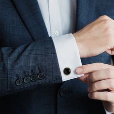 Classic and chic, our Silver and Onyx Cufflinks grant an immediate ensemble boost to your formal wardrobe. Smooth, deep Onyx discs nestle inside silver-finished settings for a simple, classic look suitable for any event. The expert craftsmanship of our base metal cufflinks ensures long-lasting durability. Pairs perfectly with our Onyx Inlaid Tie Clip. Elegant Black Cufflinks For Business, Black Cuff Jewelry For Business, Classic Black Business Cufflinks, Elegant Black Cufflinks For Wedding, Black Classic Wedding Cufflinks, Classic Polished Cufflinks For Formal Occasions, Classic Polished Cufflinks For Formal Wear, Classic Black Wedding Cufflinks, Elegant Black Wedding Cufflinks