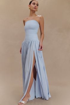 Summer set.The MAUREEN Cotton Shirring Maxi Dress is the epitome of effortless elegance. This strapless dress features a shirred bodice that provides a comfortable and flattering fit, while the longline bodice extends into a beautifully gathered skirt. With a maxi length and a subtle leg split, this dress offers both sophistication and a touch of allure. Fully lined for added comfort, the Maureen Cotton Shirring Maxi Dress is perfect for any occasion where style and grace are paramount. Powder Blue Dress, Leg Split, Ceremony Dresses, Summer Set, Gathered Skirt, Effortless Elegance, Style And Grace, Crepe Dress, White Maxi Dresses