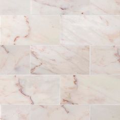 white and pink marble tiles are arranged in rows