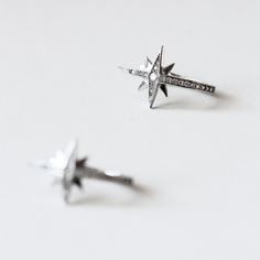 Metal: 925 Sterling Silver Stone: Brilliant cut, Pave brilliant set Stone weight: 0.03 ct (2.0mm) (piece) Total stones weight: 0.14 cttw (piece) Total stones weight: 0.28 cttw (pair) Overall Dimensions: 22mm x 13mm Silver Star-shaped Jewelry With Single Cut Diamonds, Sterling Silver Star-shaped Diamond Earrings, Silver Star-shaped Diamond Earrings As Gift, Silver Star-shaped Diamond Earrings For Gift, Sterling Silver Star Jewelry With Diamond Accents, Celestial Diamond Silver Earrings, Silver Star-shaped Diamond Earrings, Silver Star-shaped Diamond Earrings With Accents, Star-shaped Silver Diamond Earrings