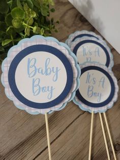 four baby boy cupcake toppers on sticks