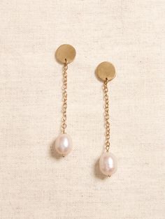 LUSTROUS PEARL COLLECTION: Every pearl is a natural wonder.  With their expansive variety of shapes, colorations, and sizes, our hand-crafted jewelry pairs gorgeous hand-picked pearls with brass or gold-plated brass chains and fittings for a collection of pieces that are perfect for any occasion.  Pretty white drop pearls dangle from delicate brass chains and small circular brass post earrings.  Sterling silver post backs.  Length: 2. 25" (5. 7cm) 14k Gold-filled Teardrop Pearl Chain Jewelry, Teardrop 14k Gold Filled Pearl Chain Jewelry, Teardrop Pearl Chain Jewelry In 14k Gold Filled, Everyday Pearl Drop Jewelry, Yellow Gold Jewelry With Pearl Charm, Everyday Drop Pearl Jewelry, Brass Dangle Jewelry With Pearl Charm, Brass Jewelry With Pearl Charm For Weddings, Classic Metal Jewelry With Pearl Drop