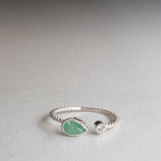 Stunning Open ring set with Turquoise Green zircon and White Zircon. Adjustable Stacking ring, one size fits most ring Suitable for Ring sizes 4.5-7.75 (US) / 49-56 (European) Gorgeous dainty open ring that will have you smiling like an angel all day! Featuring 2 Zircons in Stunning, Romantic colors One Zircon is Pear shaped about 7 mm long and 4 mm wide and comes in Various colors (see picture). The second Zircon is always white 1.75mm Made from Sterling Silver (925) For Other sizes please cont Adjustable Emerald Open Ring, Adjustable Open Emerald Ring, Adjustable Open Emerald Ring For Promise, Adjustable Open Emerald Birthstone Ring, Adjustable Open Emerald Ring With Birthstone, Adjustable Open Emerald Ring Birthstone, Adjustable Open Emerald Ring As Birthstone, Adjustable Silver Emerald Open Ring, Adjustable Green Teardrop Ring