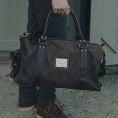 The Garrett Weekend Bag | Waxed Canvas Bag | The Normal Brand Canvas Travel Bag For Everyday Use, Canvas Shoulder Bag With Leather Handles For Overnight Trips, Functional Waxed Canvas Travel Bag For Daily Use, Waxed Cotton Canvas Bag For Travel, Black Canvas Bag With Leather Patch, Practical Everyday Bag With Leather Trim, Rectangular Weekender Bag With Waxed Finish For Everyday Use, Duck Canvas Weekender Bag With Leather Handles For Everyday, Waxed Finish Rectangular Canvas Travel Bag