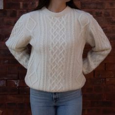 This Aran Crewneck 100% Alpaca Cable Knit Sweater is a timeless, warm yet lightweight cable knit sweater in three classic colors. A relaxed, sophisticated fit. Casual Luxury, Alpaca Sweater, We Made It, Favorite Sweater, Knit Pattern, Mens Sportswear, Cable Knit Sweater, Crewneck Sweater, Clothing Company